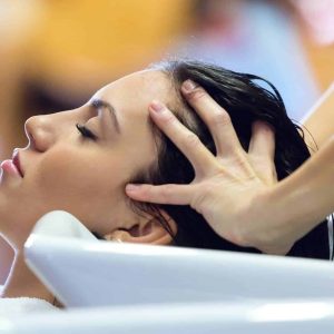 beautiful-young-woman-washes-hair-in-a-beauty-salon
